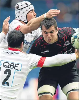  ??  ?? Stuart McInally (right) is closed down by Saracens’ Schalk Brits and Brad Barritt.