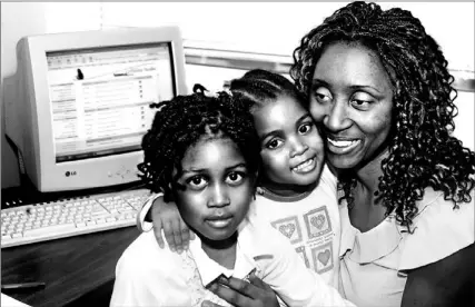  ?? RON BULL/TORONTO STAR ?? Karen Kindness, with her children Courtney, 5 and Michelle, 3, is building a better future through an innovative pilot project that’s helping 30 single moms complete their education. The project is being offered by WoodGreen Community Services, a...