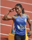  ?? AP, PTI ?? LEFT: Nirmla competes in her women’s 400m heat in Jakarta on Saturday. RIGHT: Hima Das salutes after completing her women’s 400m heat. —