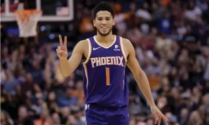  ?? Photograph: Matt York/AP ?? Devin Booker and the Suns are holding their own in the tough Western Conference.