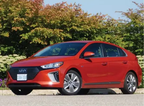  ?? JIM KENZIE PHOTOS FOR THE TORONTO STAR ?? The 2018 Hyundai Ioniq hybrid pricing starts at $24,299. There’s decent room for four, five in a pinch, and the hatch opens to a good-sized cargo area.