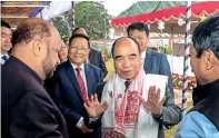  ?? PTI ?? Newly sworn-in Chief Minister of Mizoram Zoramthang­a being greeted by AGP leaders Prafulla Kumar Mahanta and Atul Bora at his oath ceremony at Raj Bhavan in Aizawl on Saturday. —