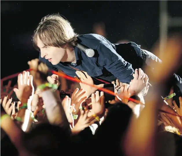  ?? Christophe­r Polk/ Getty Images ?? Thomas Mars of Phoenix performs at the Coachella Valley Music & Arts Festival in Indio, Calif. Phoenix may have hit the ‘sophomore slump’ with Bankrupt!.