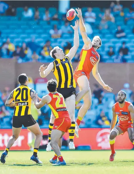  ?? Picture: MARK BRAKE/GETTY IMAGES ?? Hawthorn’s Ben McEvoy and Gold Coast Suns big Jarrod Witts fly for the footy.