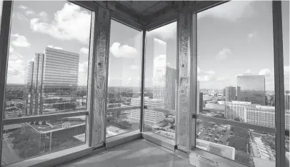  ?? Karen Warren photos / Houston Chronicle ?? The view from the top floor of PMRG’s new 18-story office tower at 3737 Buffalo Speedway in the Greenway Plaza area.