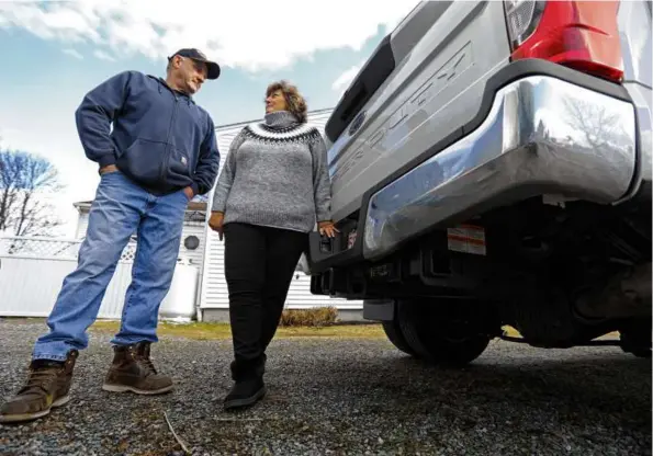  ?? PAT GREENHOUSE/GLOBE STAFF ?? Steve and Rhonda Anderson were shocked when their insurance premium surged after Steve backed his truck into a fence pole.