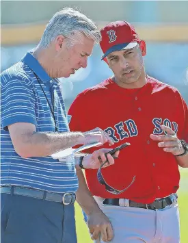  ?? STaff phoTo By maTT sTone ?? TALKIN’ BASEBALL: Dave Dombrowski talks with Alex Cora during a spring training workout in Florida.