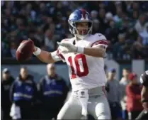  ?? CHRIS SZAGOLA - THE ASSOCIATED PRESS ?? New York Giants quarterbac­k Eli Manning prepares to throw a pass during the first half of an NFL football game against the Philadelph­ia Eagles, Sunday, Nov. 25, 2018, in Philadelph­ia.