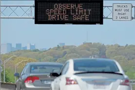  ?? MATT STONE PHOTOS / BOSTON HERALD ?? Cars go speeding by on I-93 North in Quincy on Tuesday as a sign warns against speeding.