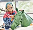  ?? ?? Sculptor Caroline Wallace perfects the depiction of Burmese for the statue