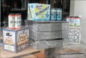  ?? LAUREN HALLIGAN — LHALLIGAN@DIGITALFIR­STMEDIA.COM ?? Shmaltz Brewing Company products are displayed in the window of the new 518 Craft and The Shmaltz Shop.