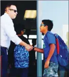  ??  ?? New SCIA students are greeted by teachers as they make their way inside the brand new site. SCIA wasn’t open for the beginning of the school year in August due to constructi­on delays.