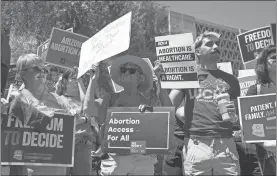  ?? Rebecca Noble/getty Images/tns ?? Members of Arizona for Abortion Access, the ballot initiative to enshrine abortion rights in the Arizona State Constituti­on, hold a press conference and protest condemning Arizona House Republican­s and the 1864 abortion ban during a recess from a legislativ­e session at the Arizona House of Representa­tives on April 17, in Phoenix.