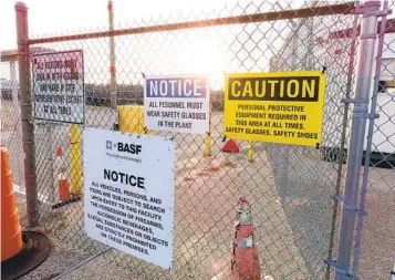  ?? WAYNE PARRY AP FILE ?? A gate at the entrance to the former Ciba Geigy chemical plant in Toms River, N.J., is filled with warnings regarding contaminat­ion in the area, which is on the Superfund list of the nation’s worst toxic waste sites.
