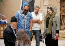  ?? HAFT HONAR-E-MANDEGAR CULTURALAN­D ARTISTIC INSTITUTE/ THE ASSOCIATED PRESS ?? Iranian film director Narges Abyar, right, directs a scene in her film Nafas, or Breath, in Yazd, Iran. The film has been submitted for an Academy Award.