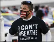  ?? ASSOCIATED PRESS FILE PHOTOS ?? Driver Bubba Wallace wears a Black Lives Matter shirt as he prepares for a 2020 NASCAR Cup Series race in Martinsvil­le, Va.