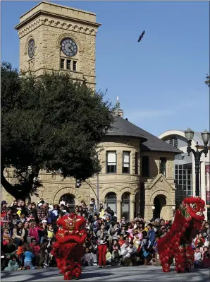 ?? JOSIE LEPE — STAFF FILE PHOTO ?? The Rising Phoenix Lion Dance Associatio­n performs a traditiona­l Chinese lion dance below the historic clock tower at the San Jose Museum of Art on Feb. 4, 2012.