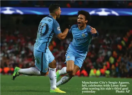  ??  ?? Manchester City's Sergio Aguero, left, celebrates with Leroy Sane after scoring his side's third goal yesterday Photo: AP