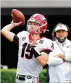  ?? CURTIS COMPTON/CURTIS. COMPTON@AJC.COM ?? Kirby Smart looks on as Carson Beck completes a pass during the G-day game on Saturday in Athens.