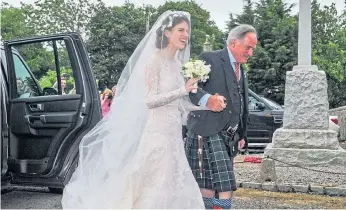  ?? ?? Rose with her father arriving at the Aberdeensh­ire church for the wedding.