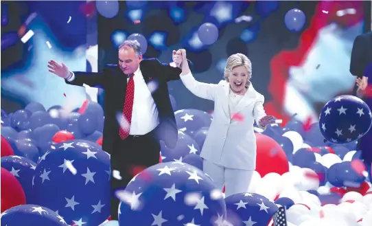  ?? STAFF PHOTO BY NANCY LANE ?? ‘IT TRULY IS UP TO US’: Former Secretary of State Hillary Clinton and running mate Tim Kaine celebrate Clinton’s Democratic Party nomination for president of the United States last night at Wells Fargo Center in Philadelph­ia.
