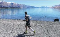  ?? PHOTO: ALPS2OCEAN­ULTRA ?? Out in front . . . Englishman Keith Burrows tackles the last few kilometres on the shores of Lake Ohau on the second day of the Alps 2 Ocean Ultra yesterday. Burrows leads the men’s supported section by 11min.