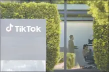  ?? AP photo ?? People work inside the TikTok Inc. building in Culver City, Calif. on Monday. House Republican­s are moving ahead with a bill that would require Chinese company ByteDance to sell TikTok or face a ban in the United States even as President Donald Trump is voicing opposition to the effort.