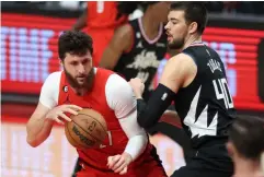  ?? AP/STEVE DIPAOLA PHOTO ?? PORTLAND Trail Blazers center Jusuf Nurkic, left, makes a move under the basket against Los Angeles Clippers center Ivica Zubac, right, during the first half of an NBA basketball game in Portland, Ore▪, Tuesday, Nov▪ 29, 2022▪