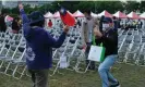  ?? Photograph: Helen Davidson/The ?? Johnny Hsiao taking photos with his wife at the end of Taiwan’s national day celebratio­n.