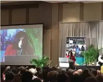  ?? (Twitter) ?? THE AUDIENCE sees the image of Rasmea Odeh projected on a screen as she speaks at the Jewish Voice for Peace conference in Chicago on Sunday.