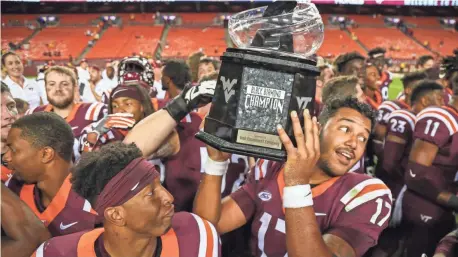  ?? BEN QUEEN, USA TODAY SPORTS ?? Josh Jackson threw for 235 yards and a TD and ran for 101 yards with another TD as Virginia Tech beat West Virginia 31-24.