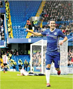  ??  ?? Capital gains: Pedro, the Spain winger, celebrates scoring Chelsea’s second goal