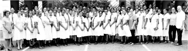  ?? Contribute­d ?? Over 60 Mount Alvernia High school students were treated to lunch at the exclusive Grand A View restaurant in Montego Bay by Principal Stacey Reynolds (centre in dark glasses), for earning blue (grade average between 70-89 per cent) and gold reports (89-100 per cent) for the academic year 2018/2019. Board members Dr Michelle Robinson (left), Melissa Chang Ferdinand (second left), Jean Lue (ninth right), Ellen Powell (second right) and Deacon Baldwin Powell (Campus Minister) also joined in the celebratio­n of this excellent achievemen­t.