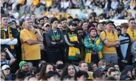  ?? Photograph: Jeremy Ng/EPA ?? Socceroos supporters anxiously watch Australia’s World Cup match against Argentina at Sydney’s Tumbalong Park on Sunday morning.