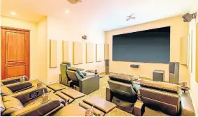  ?? CONTRIBUTE­D PHOTOS ?? Home theatre with automated reclining seats.