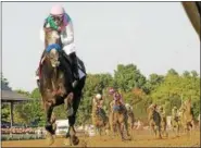  ?? PHOTO PROVIDED BY SPENCER TULIS ?? Arrogate, with Mike Smith up, blows away the field to win the 147th running of the Travers Stakes by 131/2 lengths in record time August 27, 2016at Saratoga Race Course.