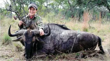  ??  ?? A heavy setup is not necessaril­y needed when hunting big game. I shot this blue wildebeest bull with a bow set at 50 pounds. In the end shot placement is what counts.