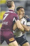  ??  ?? Daly Cherry-evans tackles Hamiso Tabuai-fidow.