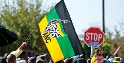  ?? /Gallo Images ?? The ANC flag flies high during the party’s door-to-door elections campaign. The liberation movement is in its dying throes due to corruption and the rise of personalit­y cults.