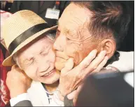  ?? Lee Ji-eun / Associated Press ?? South Korean Lee Keum-seom, 92, left, weeps with her North Korean son Ri Sang Chol, 71, during the Separated Family Reunion Meeting at the Diamond Mountain resort in North Korea on Monday. Dozens of elderly South Koreans crossed the heavily fortified border into North Korea on Monday for heart-wrenching meetings with relatives most have not seen since they were separated by the turmoil of the Korean War.