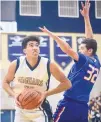  ?? ROBERTO E. ROSALES/JOURNAL ?? Atrisco Heritage’s Jordan Arroyo, left, looks to put up a shot in a recent game against West Mesa.