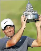  ?? /Geoff Burke USA TODAY Sports ?? Kudos to the victor: Francesco Molinari became the first Italian in about 71 years to win on the PGA Tour when he clinched the Quicken Loans National tournament on Sunday.