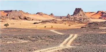  ??  ?? Exploring the sands of time in Tassili n’Ajjer with its other-worldly landscapes and prehistori­c rock art depicting life 4,000 years ago