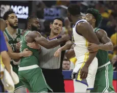  ?? AP PHOTO ?? Jaylen Brown, second from right, is held back by Jayson Tatum and referee Zach Zarba as Golden State’s Draymond Green, second from right, is held by Celtics guard Marcus Smart during the first half of Game 2 of the NBA Finals in San Francisco on Sunday.