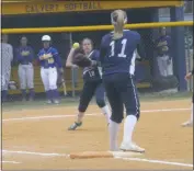  ?? STAFF PHOTO BY ANDY STATES ?? La Plata’s Jasmine Wathen prepares to throw to Ava Krahling at first after fielding a bunt in the first inning of the Warriors’ game at Calvert on Thursday afternoon. Calvert rallied for six runs in the bottom of the seventh to defeat the Warriors 8-7.