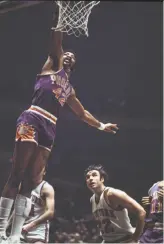  ?? Robert Kradin / Associated Press 1971 ?? Before there was Dr. J, there was a playground legend called “The Hawk.” Connie Hawkins (driving to the hoop against the New York Knicks in 1971) helped revolution­ize the game and was inducted into the Basketball Hall of Fame.