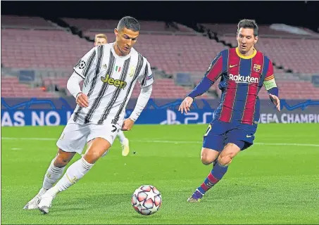  ?? REUTERS ?? Cristiano Ronaldo (L) scored twice for Juventus from penalties against Lionel Messi’s Barcelona in their Champions League match at the Camp Nou.