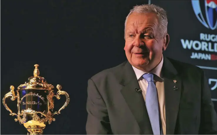  ??  ?? Sir Bill Beaumont, World Rugby chairman, with The Webb Ellis Cup.