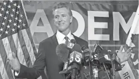  ?? RICH PEDRONCELL­I/AP ?? Incomplete returns showed California Gov. Gavin Newsom headed toward a landslide win with about 65% of the vote.