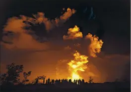  ?? JANICE WEI — NATIONAL PARK SERVICE ?? People watch an eruption from Hawaii’s Kilauea volcano on the Big Island on Sunday.